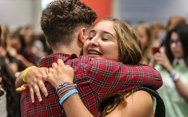 Photographs © Copyright by Julian Andrews. Eye R8 Productions Ltd. 2015. 15/08/15. Excel, London, England. Commission May0064424 You Tube Event. 9,000 fans descended on London's ExCel centre for YouTube's 'Summer in the City' annual event....the UK's biggest YouTube fan event for YouTube teenagers. Fans come from all over not just the UK but the world to meet these YouTube stars who are now deemed as major, mainstream celebrities, with some attracting millions of followers! LOTS OF HUGGING GOING ON AT THE MEET AND GREET SESSIONS AS FANS MEET THEIR YOU TUBE IDOLS